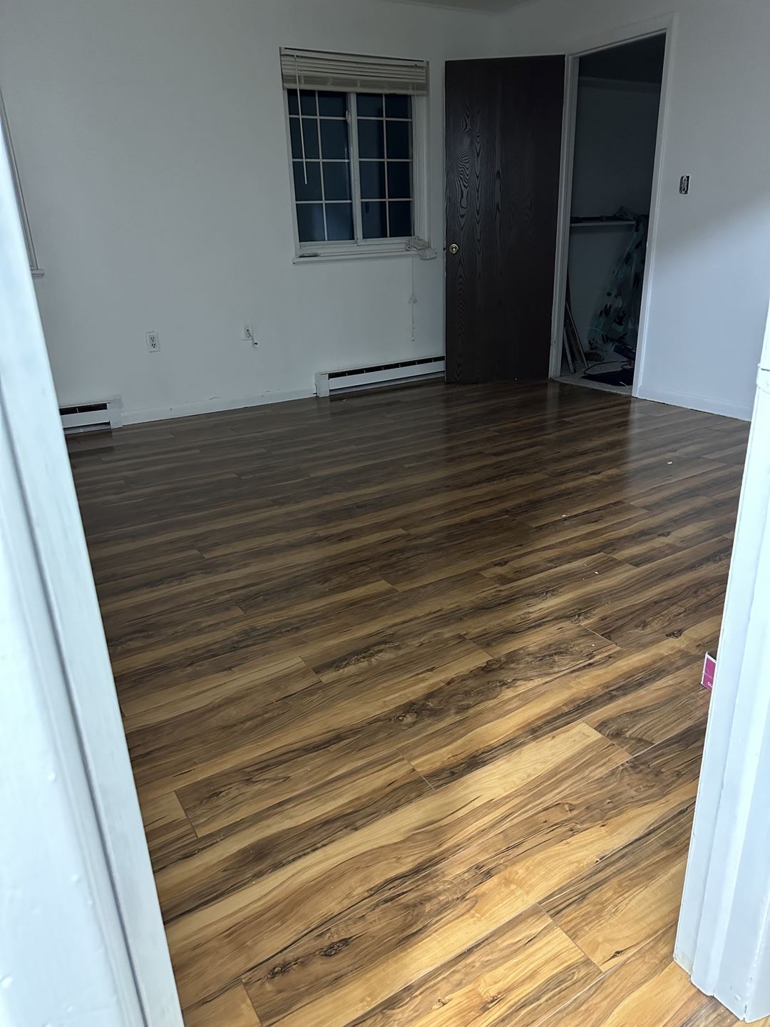 Finished plank flooring in a bedroom