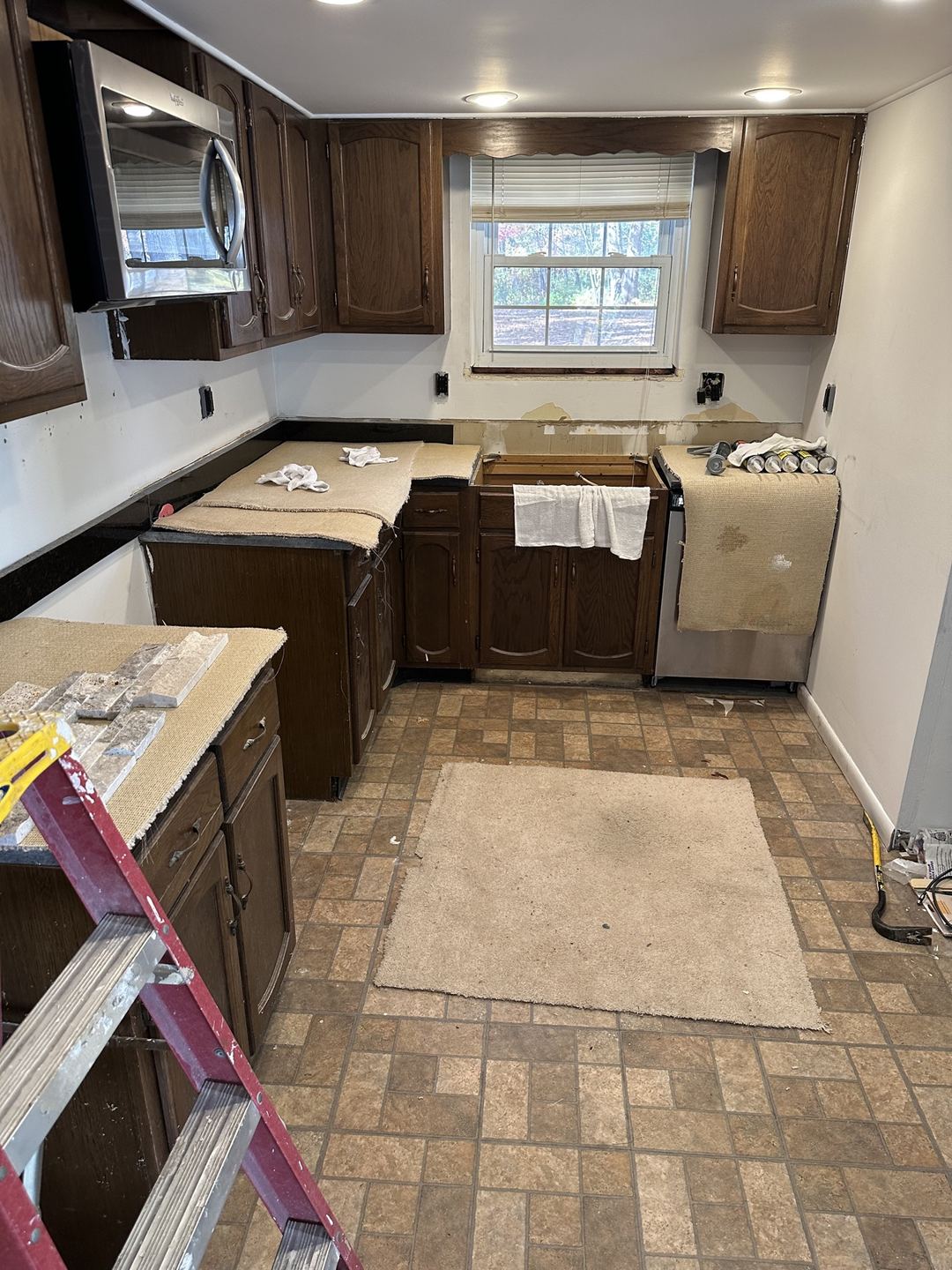 Kitchen before the stacked-stone backsplash installation